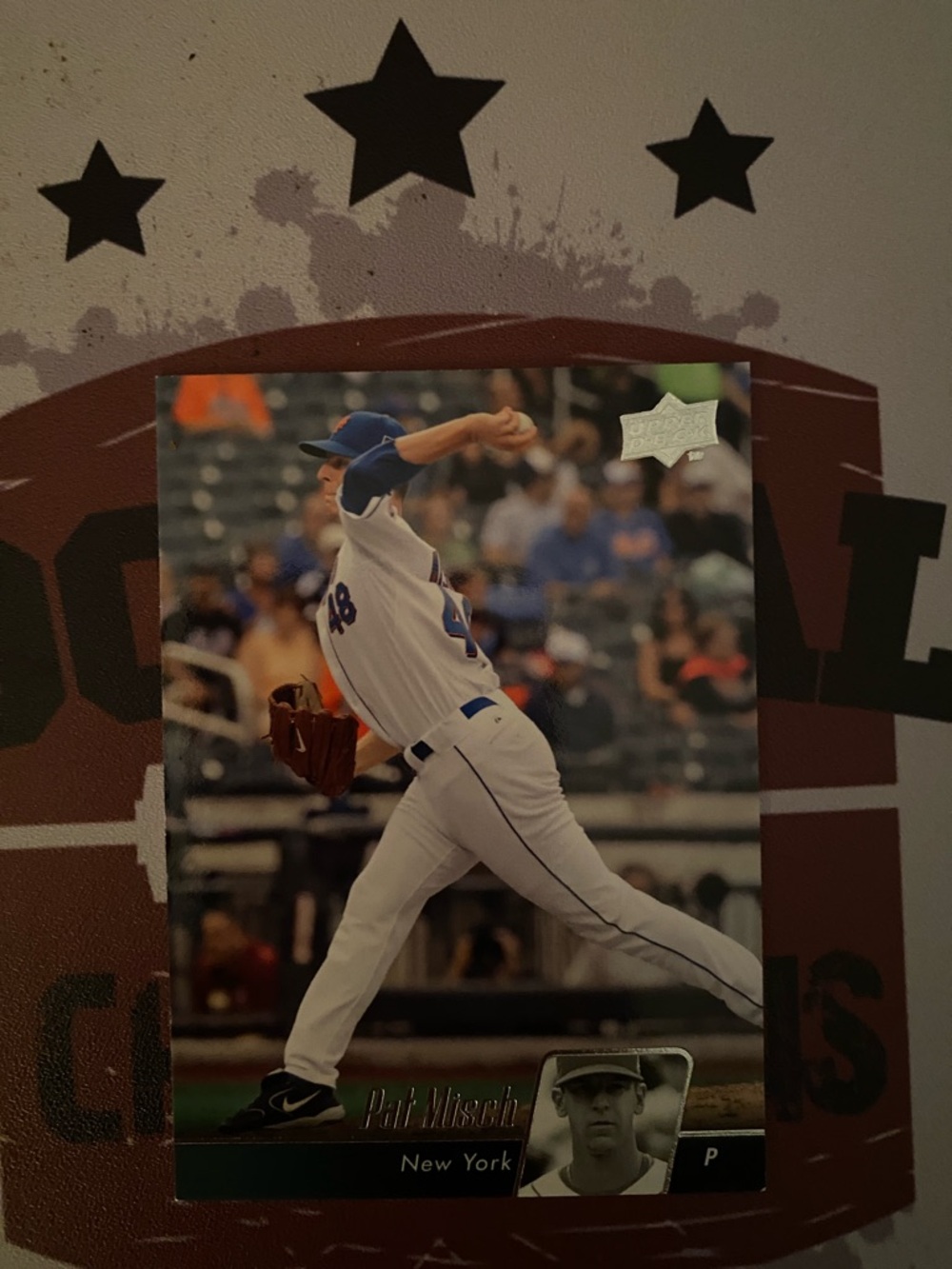 Baseball Card Featuring Pitcher in White and Blue Uniform